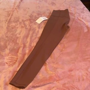 Athleta salutation stash pocket II Tight